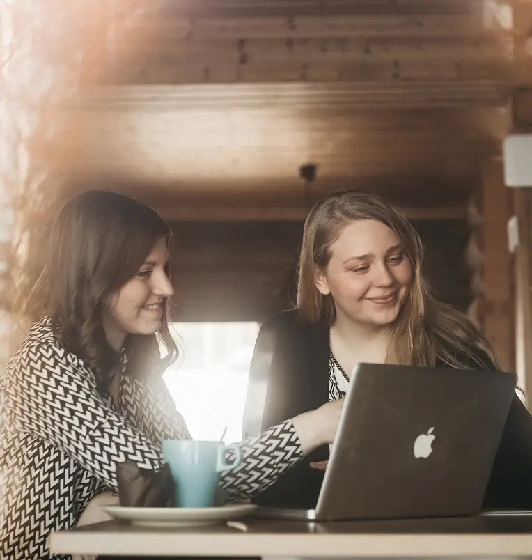 two women using computer at Revontuli sauna