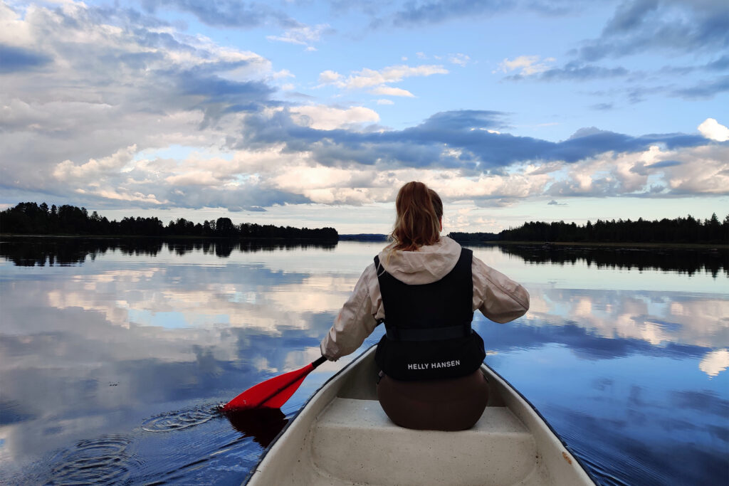 young woman canoeying on Lake Virmas
